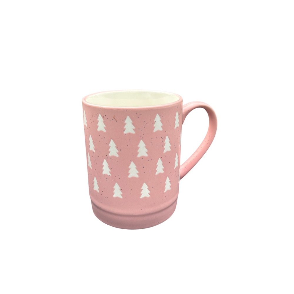 pink ceramic mug with a speckled finish and white tree‎ pattern. Christmas Trees